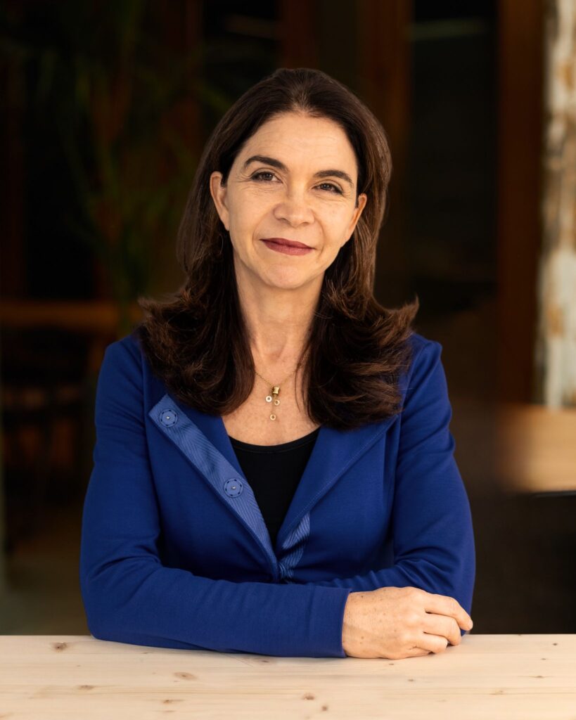 Kelly Richdale sat at a desk in an office.