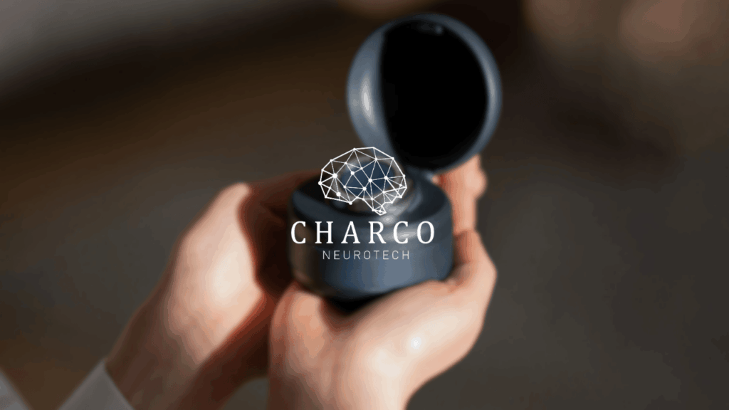 Charco Neurotech company logo on a photo of the CUE1 / CUE1+ wearable device being held in pair of hands.