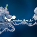 Constructive Bio company logo overlaid on a background image showing a graphic mockup of a ribosome, cellular structures, found in all cells, that are responsible for protein synthesis, translating genetic information from mRNA into proteins.