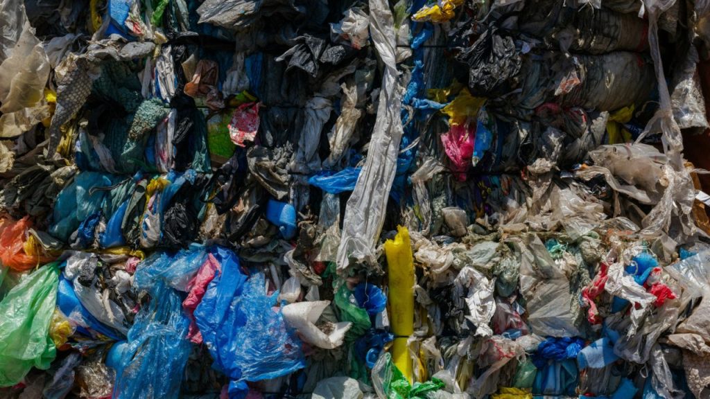 A photo of plastic bags and other waste in a range of colours.