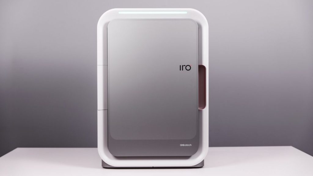 Oribiotech IRO manufacturing platform which enables advanced cell and gene therapy for applications like cancer treatment. The device is rectangular, like a small desktop fridge, with the letters "IRO" printed on the door.