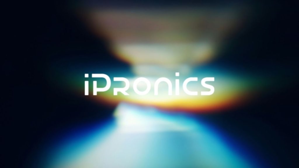 iPronics company logo overlaid on an image of light refraction showing the rainbow effect when light is refracted.