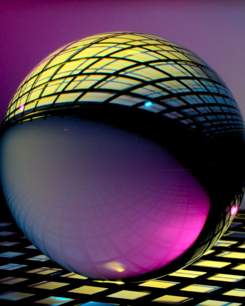 An abstract image of a glass sphere on a tiled structure showing the reflection on its surface. The image represents AI Venture Capital.
