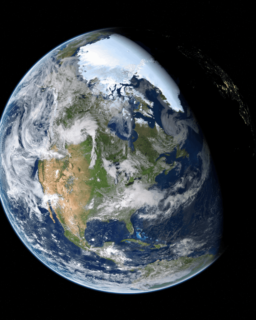 View of Earth from space showing city lights and sunlight over the horizon — representing climate tech venture capital for climate tech, space-based systems, and sustainability at planetary scale.