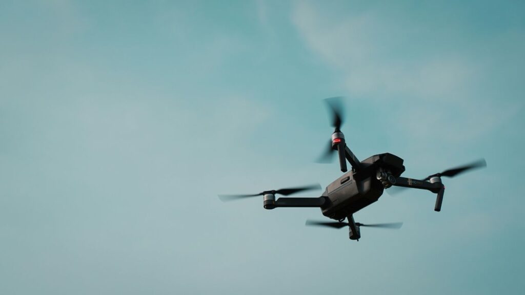 A drone hovering in the sky which is showing one of the areas Periphery's embedded and extended Internet of Things (XIoT) platform protects, along with other IoT devices.