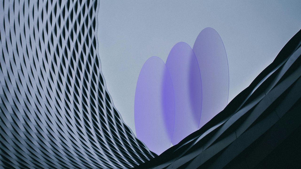 An image of a curved building with three ellipses rising from behind it to symbolise the AI LLM commoditisation curve.
