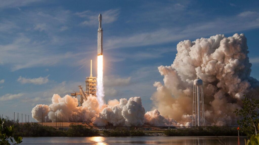 A rocket blasting off a launch pad, representing ATMOS Space Cargo's which helps bring back cargo from space.