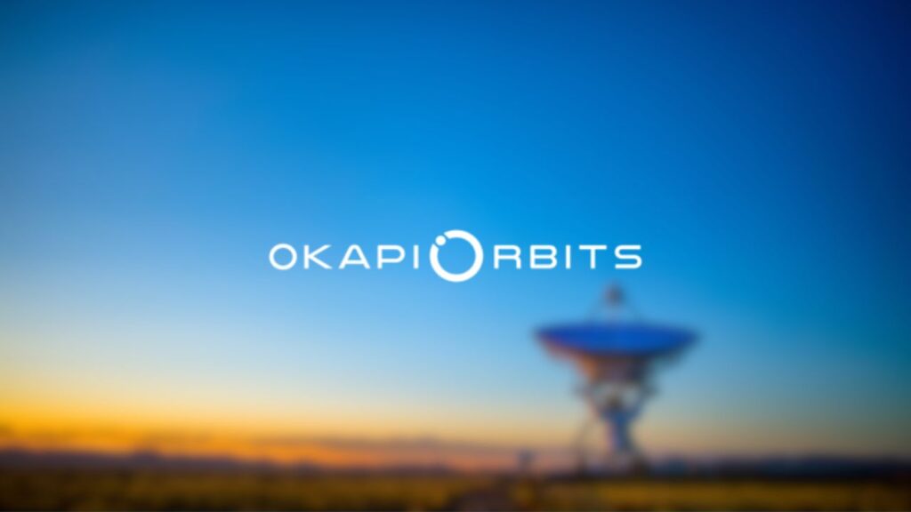 OKAPI:Orbits company logo overlaid on a photo of a satellite ground station.