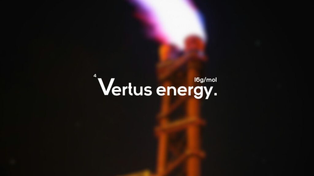 Vertus energy company logo overlaid on a photo of an industrial exhaust emitting flames to represent the biogas production process enabled by the company's technology.