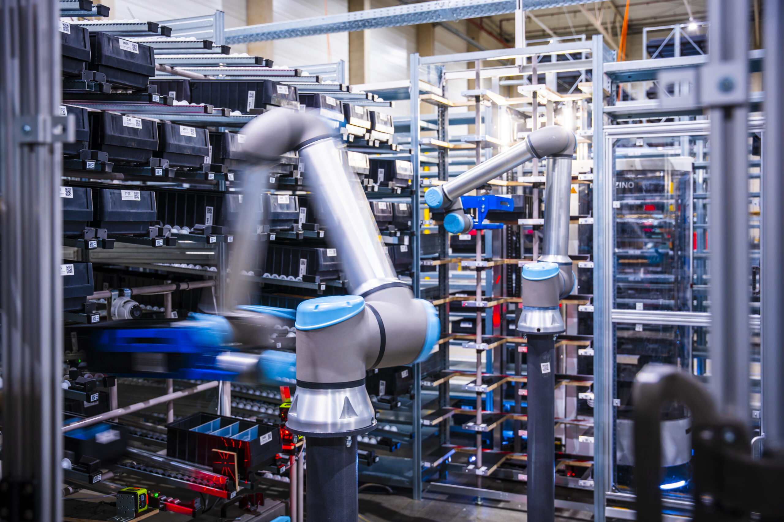 NEOIntralogistics robot in a warehouse sorting goods.