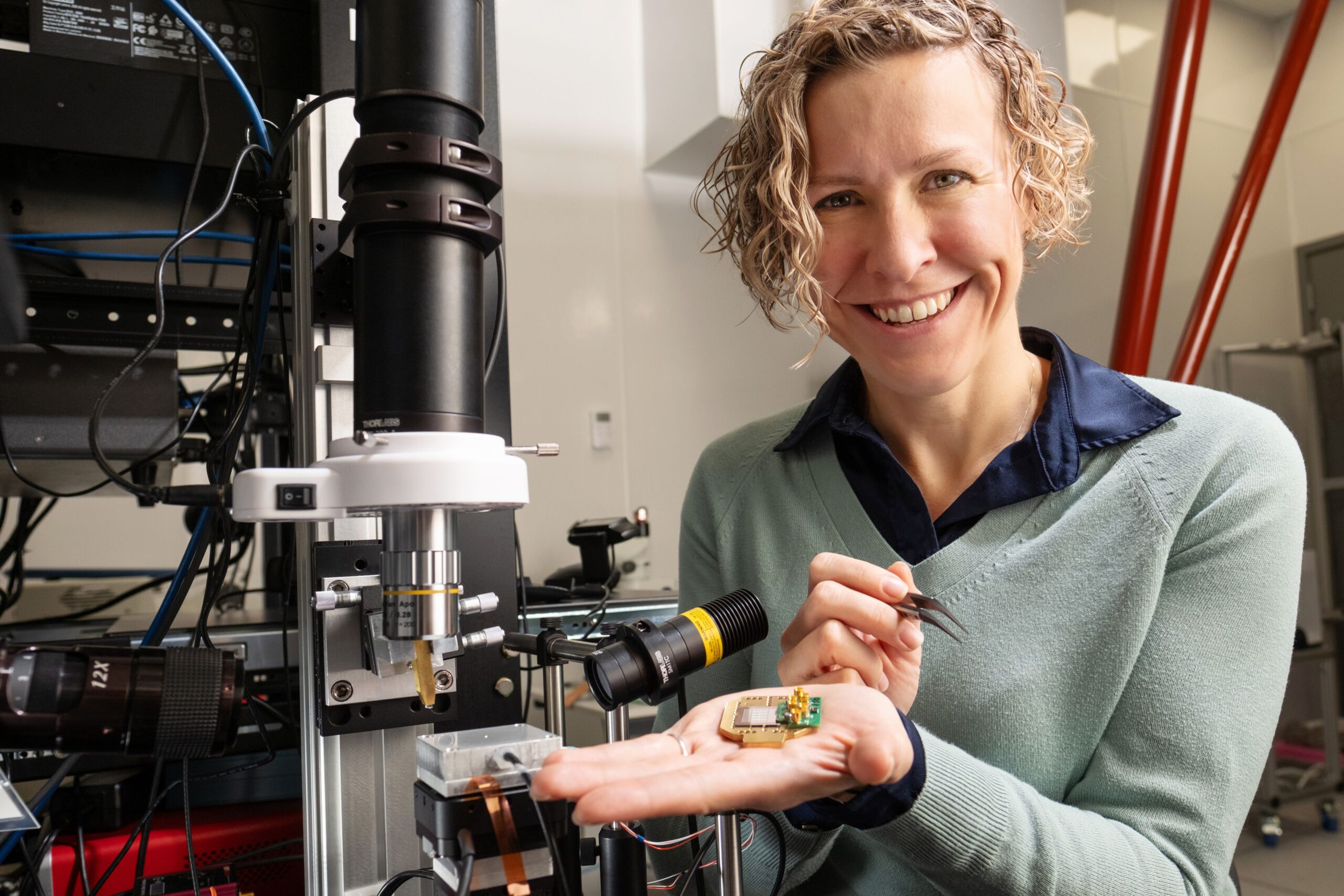 Photonic chip packaging close up, in the palm of Dr. Stephanie Simmons.