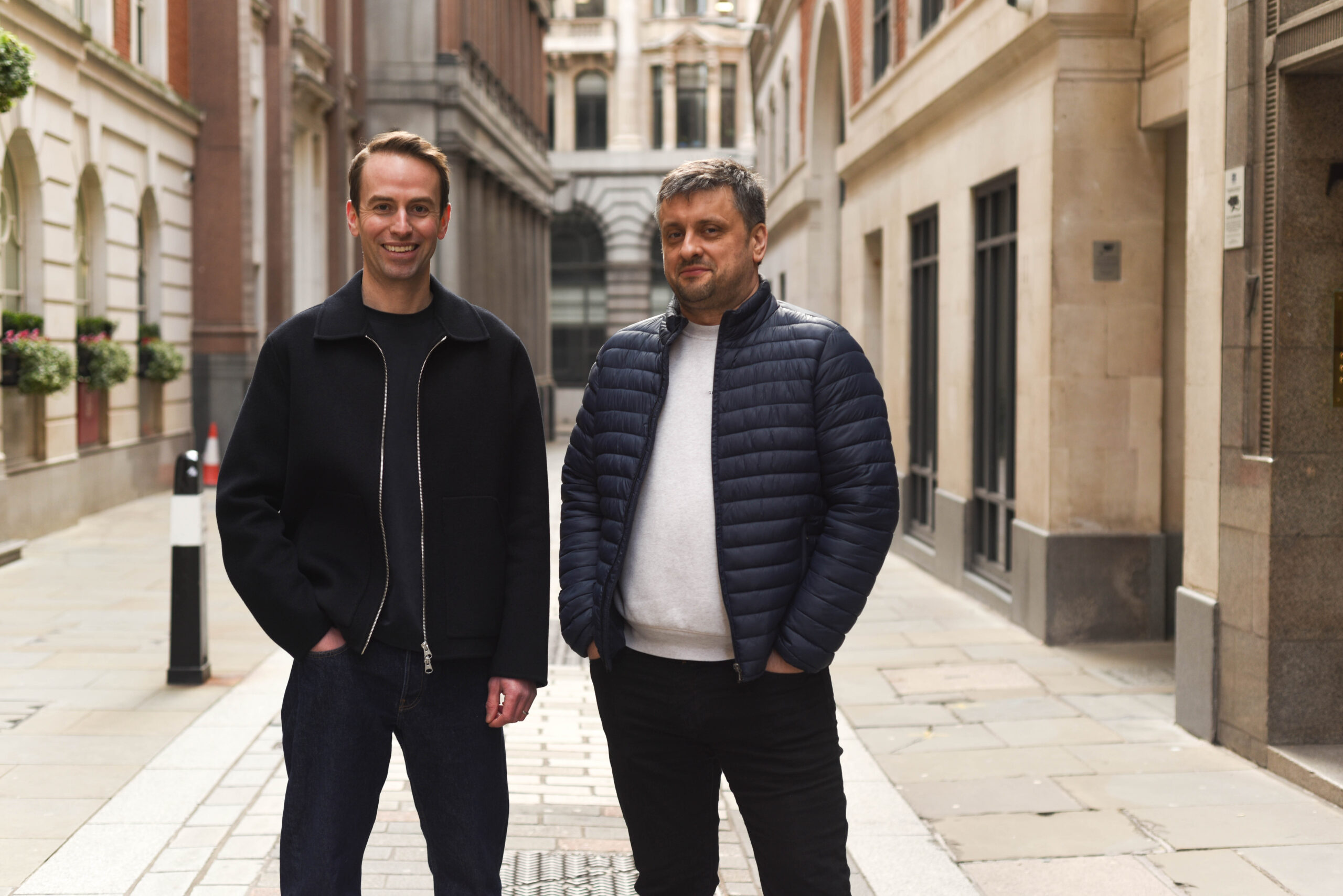 Refute co-founders Tom (left) and Vlad (right) stood on a London street.