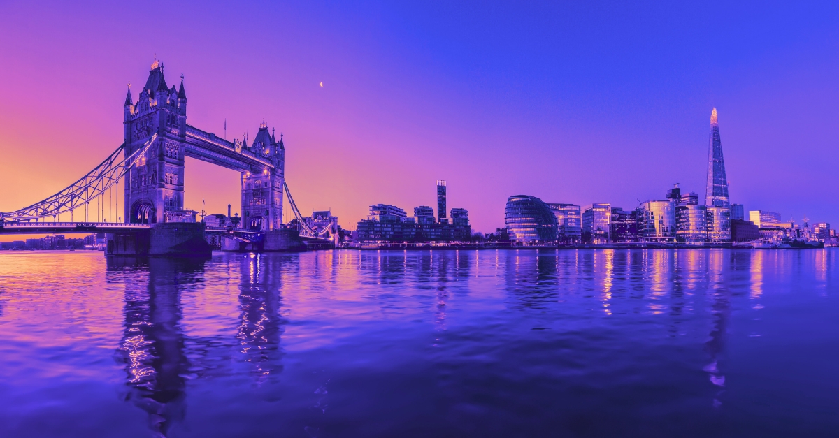 London Tower Bridge and city skyline seen from the Thames.