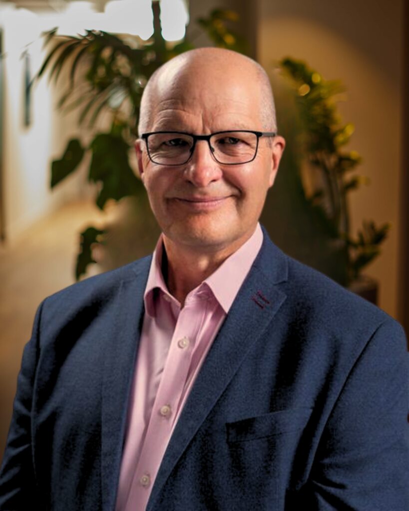 Craig Marshall wearing a suit in an office environment. Craig is a Venture Partner at Amadeus Capital Partners.