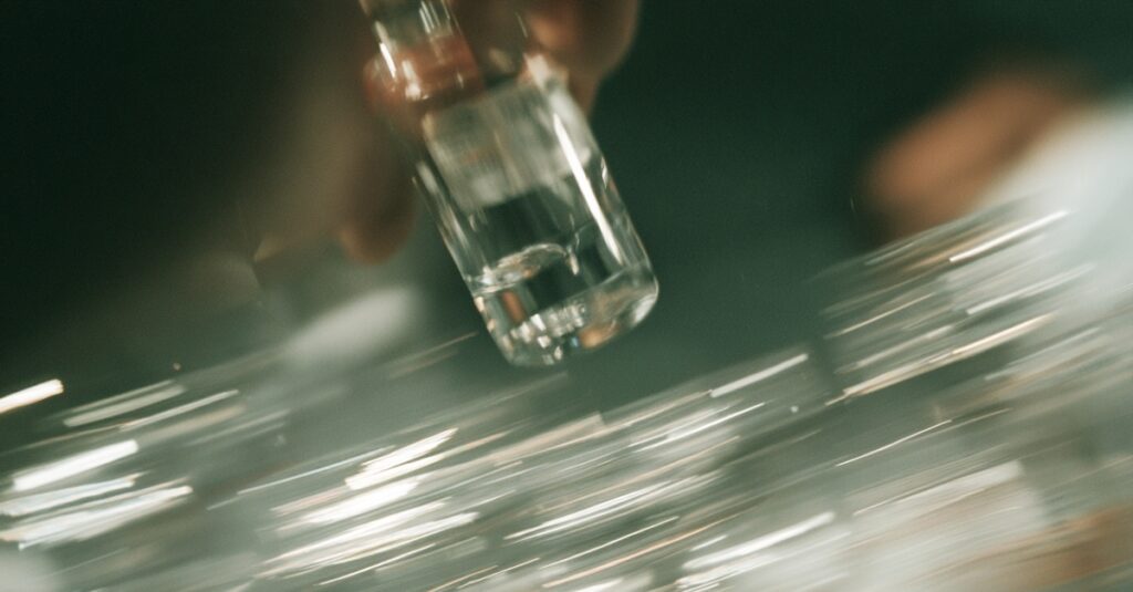 An AI-generated image of a medical vial being held by a hand.